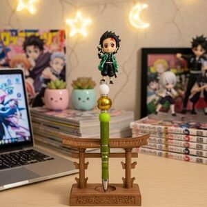 Demon-Inspired Green Character Pen with Gold Bead Accent
